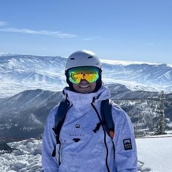 Harry Thomas in ski gear in the mountains